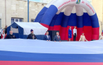В Конаково торжественно отметили День Государственного флага при участии священнослужителей